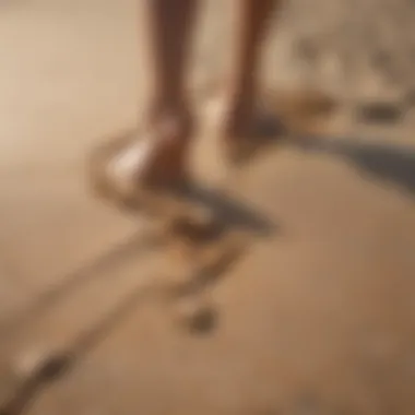 Close-up of feet in the sand during an intense workout session