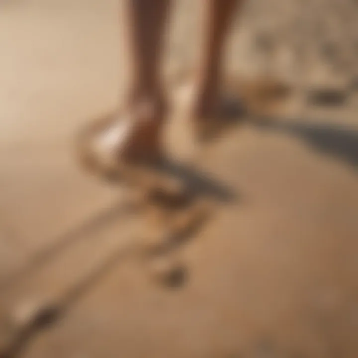 Close-up of feet in the sand during an intense workout session