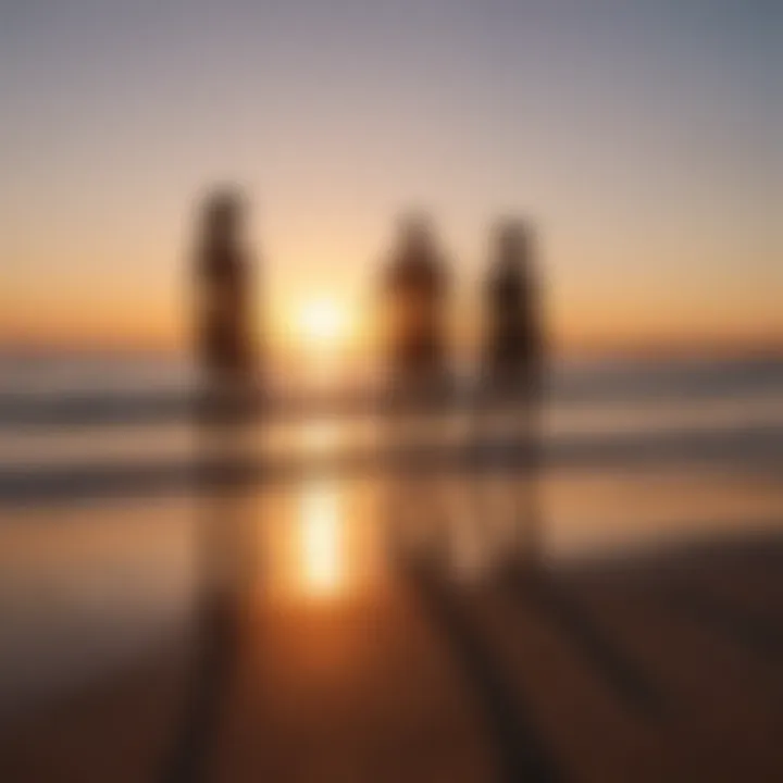 A stunning sunset with silhouettes of individuals performing exercises on the beach