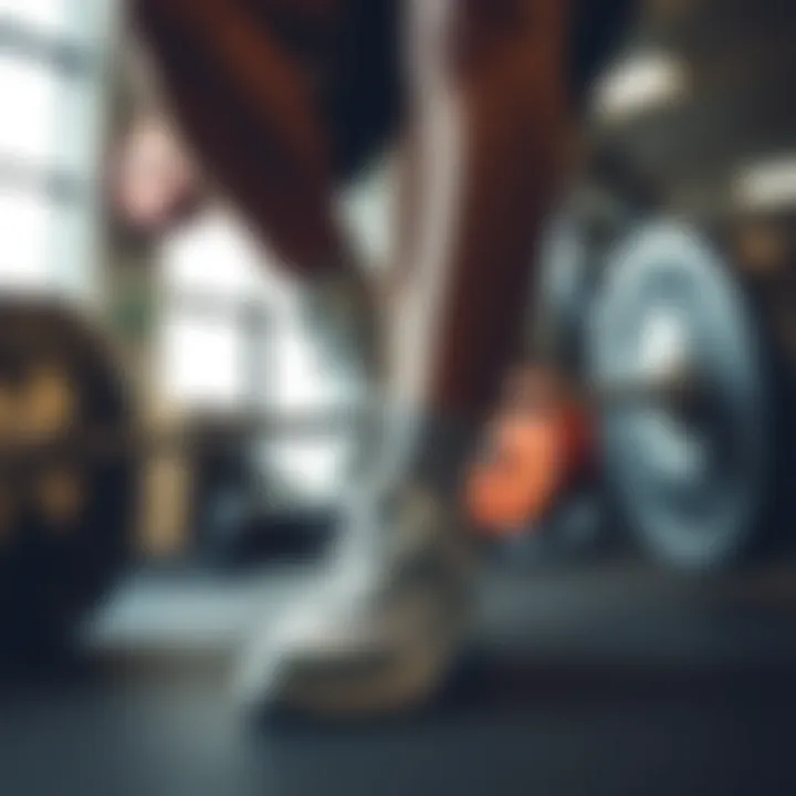 Athlete demonstrating weightlifting with tennis shoes