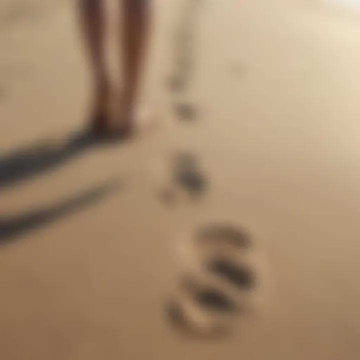 Footprints on a sandy beach, illustrating walking techniques